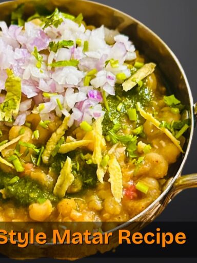 Authentic Delhi Ke Chole served with parathas and garnished with onions, tomatoes, and coriander.