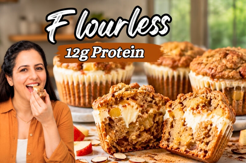 High protein apple muffins split open to show a cream cheese filling and diced apple