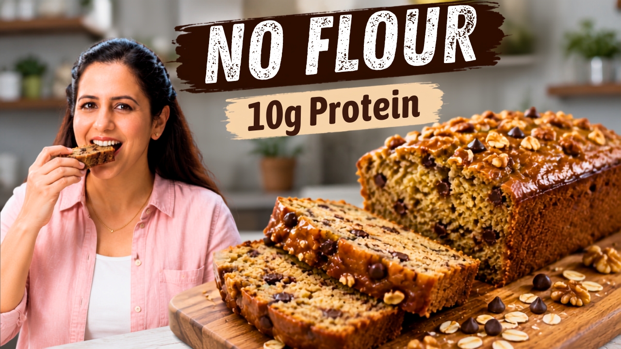 Sliced high protein banana bread loaf on parchment showing a moist crumb with walnuts and chocolate chips