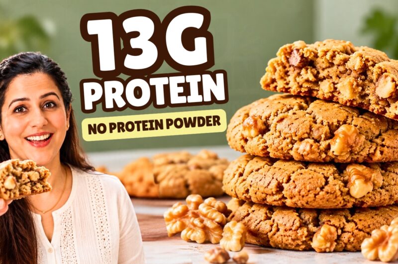 Stack of three healthy walnut cookies with the top one broken open to show a soft center and walnut pieces