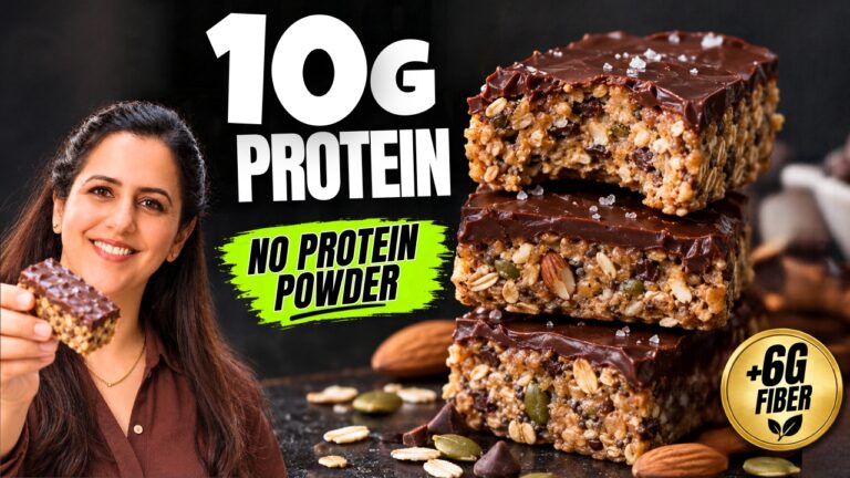 Stack of no-bake protein bars topped with dark chocolate showing oats, chia, and seeds inside