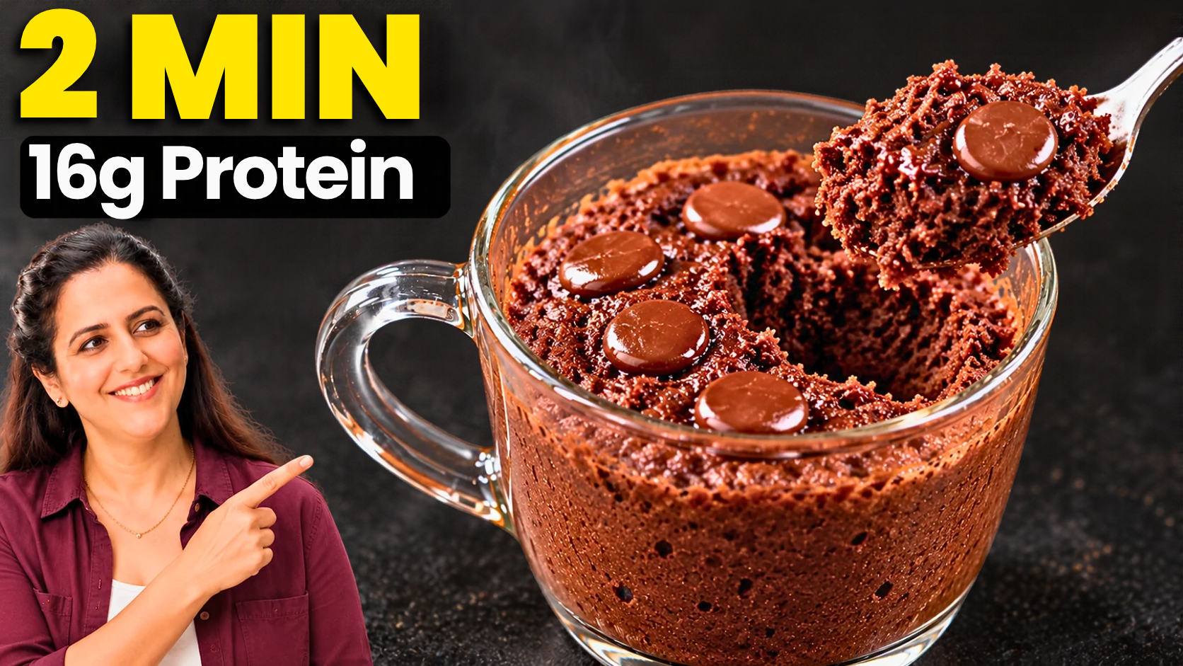 Spoon lifting a fudgy chocolate protein mug cake with a melted chocolate center from a white mug